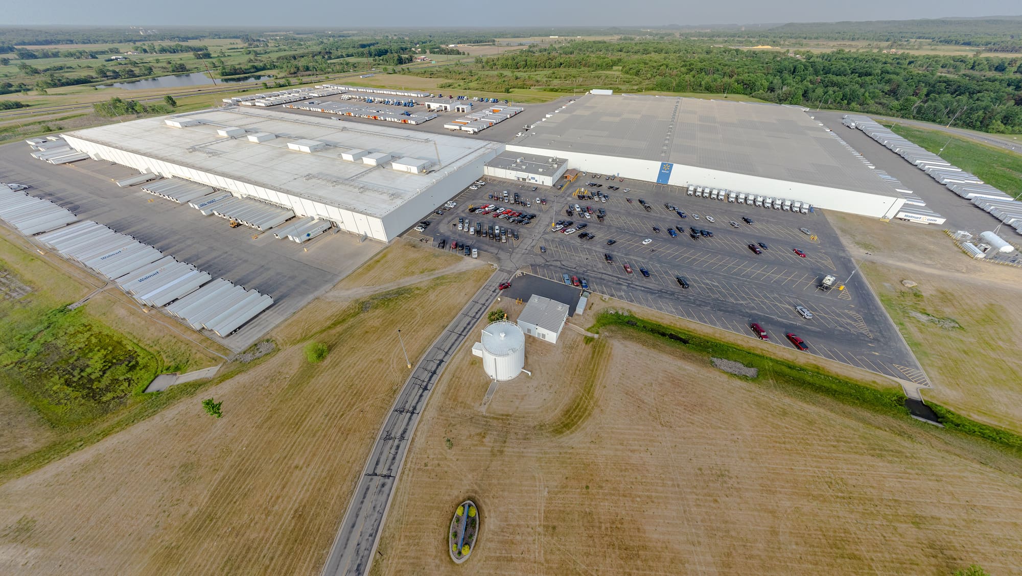 Logistics yard with containers and trucks